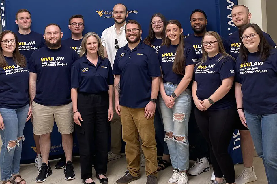WVU Law students and staff posing for a photo with those they serve at the WV Innocence Project Clinic.