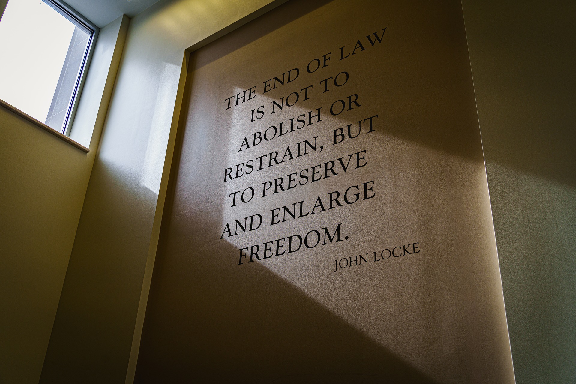 A John Locke quote appearing on a wall in the College of Law