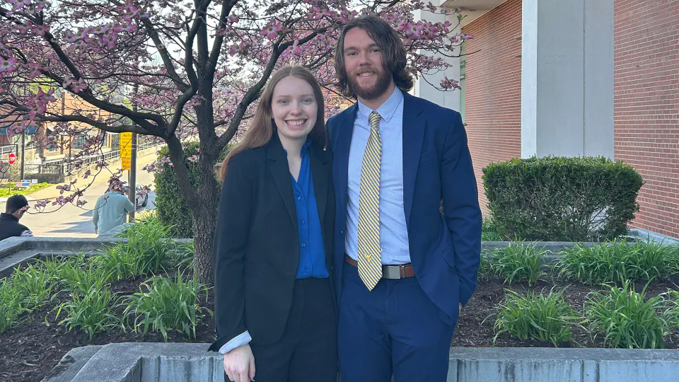 Parker and Kayla pose together at the College of Law.