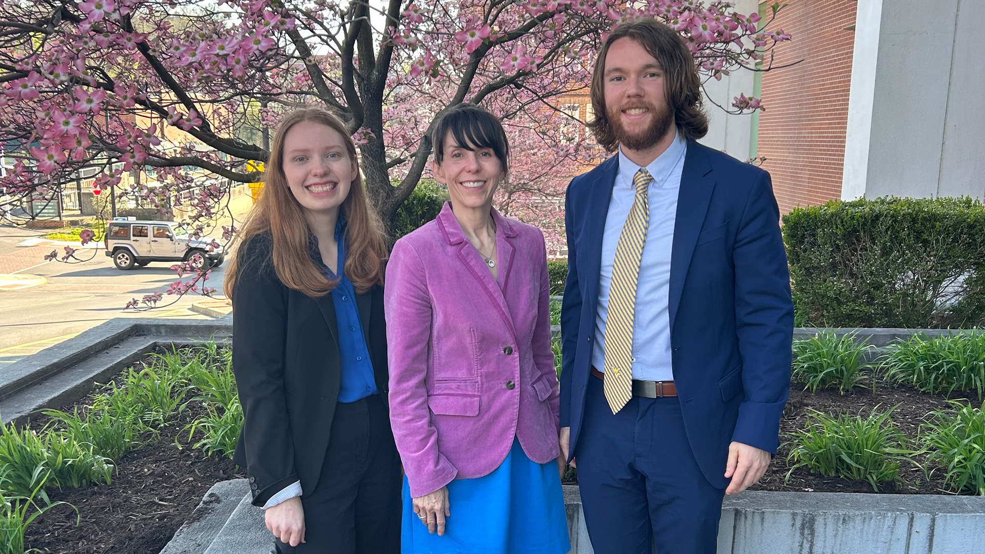 Photo of Parker Stout and Kayla Brown posing with Professor Jennifer Stephens at WVU Law.