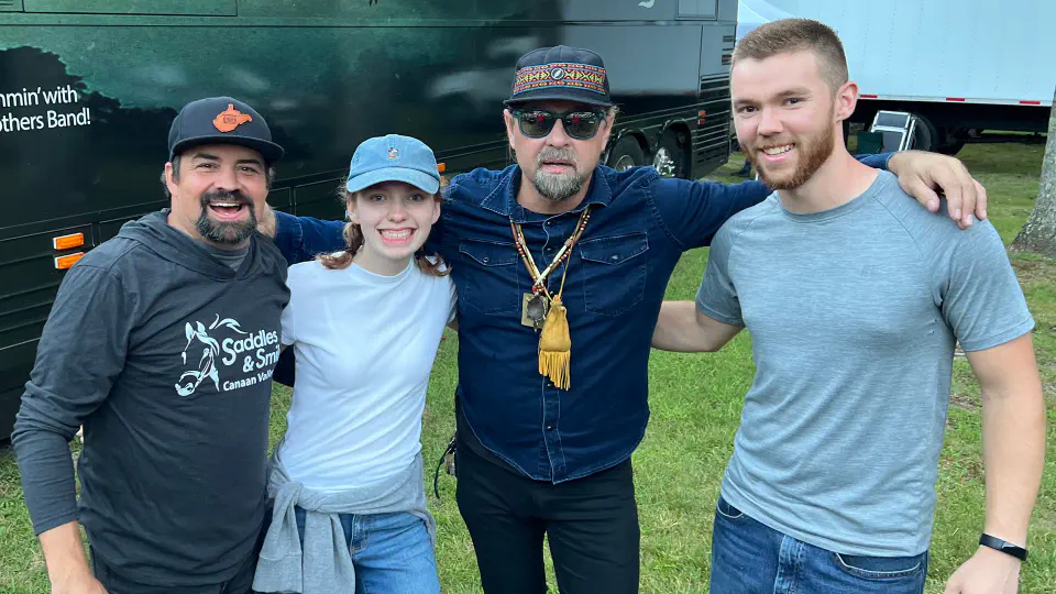 Parker and Kayla pose together with the Davison Brothers Band.